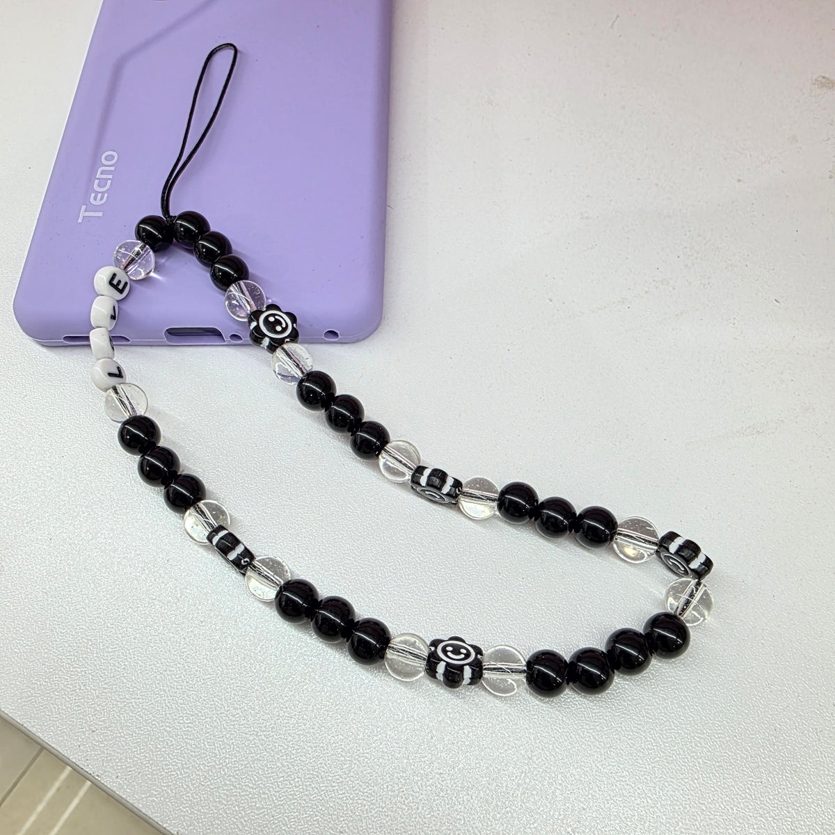 Black beaded phone charm